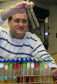  In an Atlantis science lab, Jim Holden of the University of Massachusetts grows microbes collected from hydrothermal vents on the seafloor. These thermophiles thrive in high-temperature sulfides and fluids, as hot as 200°F (95°C).