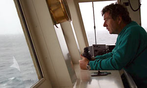 On the bridge at 6 a.m., Expedition Leader Pat Hickey gazed through rain-slicked windows to decide if it was safe to dive today. He canceled the dive when the 35-knot (40 mile-per-hour) winds and 10-foot (3-meter) seas showed no sign of abating.  