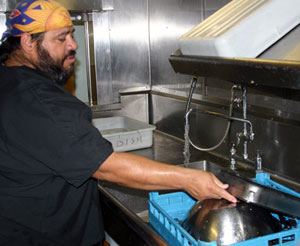 Ricky Rios, originally from Kingsville, Texas has been cooking on ocean research vessels for more than 20 years. On our cruise he works as a mess attendant, responsible for dishwashing, restocking the galley’s refrigerator and freezer, and cutting fruits and salads served at meals. (Photo by Amy Nevala)