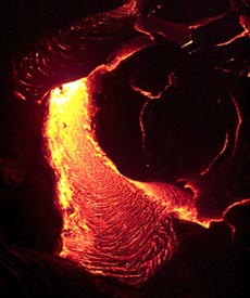  Lava flowing at night during from the Pu’u Oo eruption on Kilauea volcano Hawaii in April, 2000. Scale across photo is about 1 meter. Photo by Bruce Applegate, HMRG.