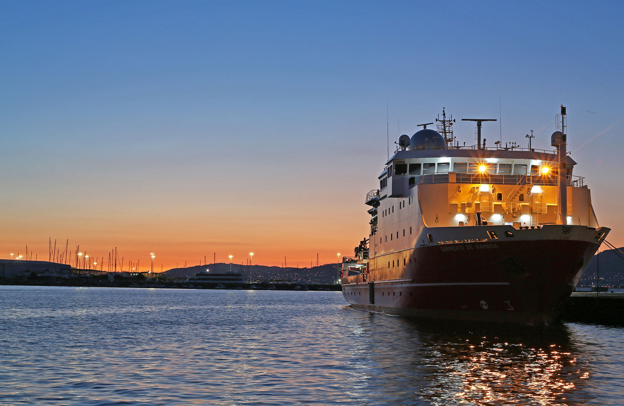 The R/V Sarmiento de Gamboa lights up the port while docked in Vigo, Spain.